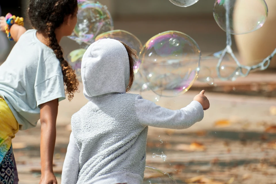 children playing with soap bubbles